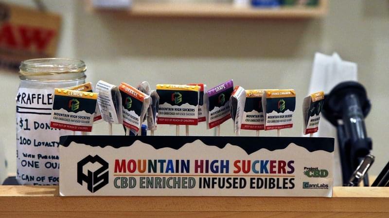 Marijuana infused lollipops are displayed at a dispensary in Denver in 2013. Aspen recently launched a marijuana education campaign to teach visitors how to use the drug safely.